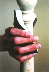 Photo of a person using a rawhide sanding pad